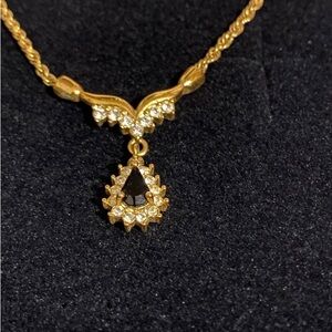 Roman gold toned faux diamond and glass stone pendant necklace